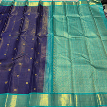 Vaibhogam- Gorgeous Navy Blue with Teal Handwoven Pure 2g Jari Korvai Kanjivaram Silk with Vairaoosi body with mayil chakram motifs woven body with beautiful borders rich pallu and contrast Vairaoosi woven blouse In teal