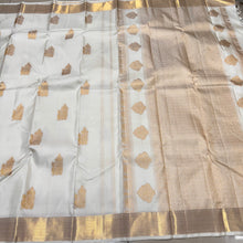 Gorgeous Offwhite with Gold Combination in Handwoven Pure Kanjivaram Silk Saree with rich Peacock driven chariot motifs woven all over the body with beautiful and intricate borders rich woven pallu and blouse with Zari strips