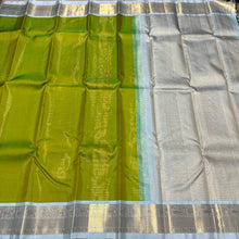 Mesmerizing Tender Leaf Green with Ice Blue combination with Vairaoosi woven gorgeous body with intricately woven borders with elephants and yazhi motifs with gorgeous pallu with yazhis elephants and peacocks woven with beautiful ice blue contrast blouse.
