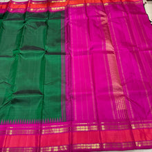 Sarasangi-Stunning Bottle Green with Rani Pink Handwoven Pure Jari Korvai Kanjivaram Silk with Fishpet Borders with temples woven with rich seer pallu and contrast woven blouse.