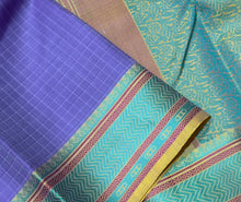 Saraswati- Beautiful Lavendar with Green and Yellow Handwoven Premium Zariless Kanjivaram Silk with Muthukattam Self Checked body with beautiful borders rich pallu and contrast jacquard woven beautiful blouse