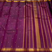 Saraswati- Beautiful Deep Magenta Handwoven Pure Zariless Kanchipuram Silk with Silk thread buttas woven all over the body with small matte finish thread borders rich pallu and self colored blouse