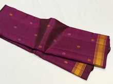 Saraswati- Beautiful Deep Magenta Handwoven Pure Zariless Kanchipuram Silk with Silk thread buttas woven all over the body with small matte finish thread borders rich pallu and self colored blouse