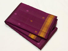 Saraswati- Beautiful Deep Magenta Handwoven Pure Zariless Kanchipuram Silk with Silk thread buttas woven all over the body with small matte finish thread borders rich pallu and self colored blouse