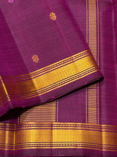 Saraswati- Beautiful Deep Magenta Handwoven Pure Zariless Kanchipuram Silk with Silk thread buttas woven all over the body with small matte finish thread borders rich pallu and self colored blouse