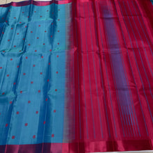Nayaki- Beautiful Ananda Blue with Red Handwoven Pure Zariless Kanjivaram Silk with lovely banarasi pet matte finish borders with silk thread buttas rich pallu and contrast red blouse